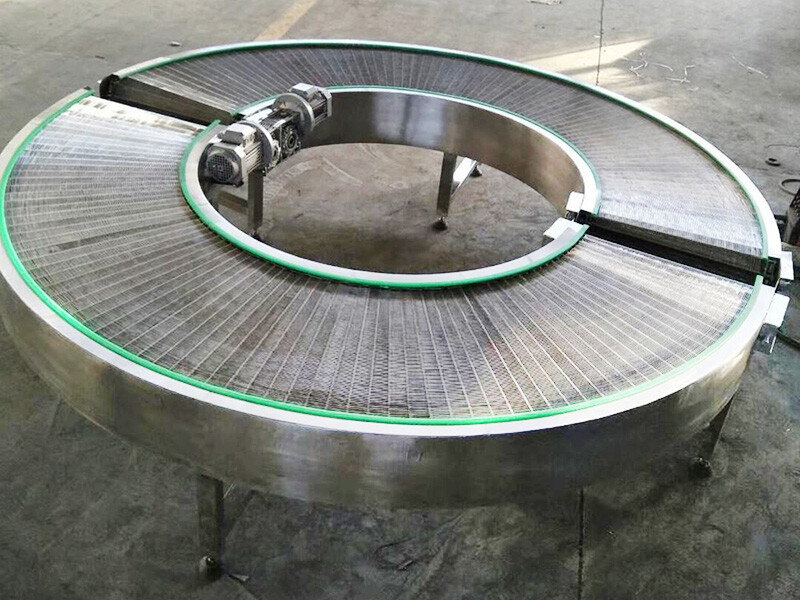 Conveyor sabuk jaring belok