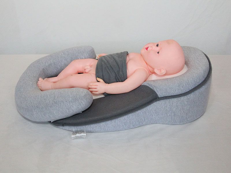 Infant anti-startle, anti-overflow, and anti-cushioning bed